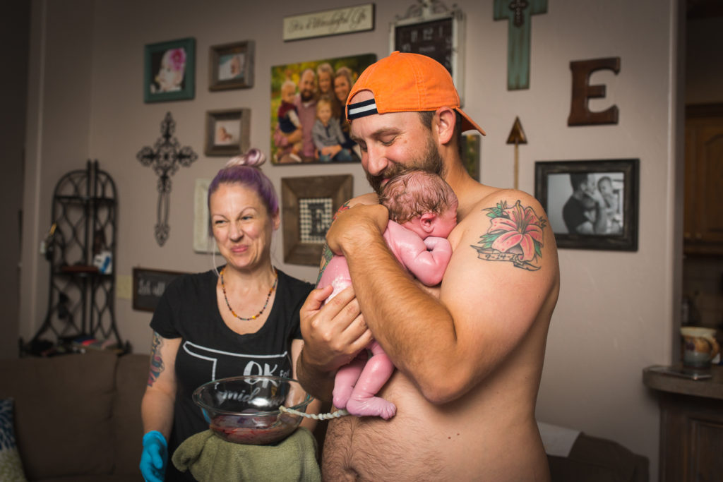 dad holding baby oklahoma city birth photographer