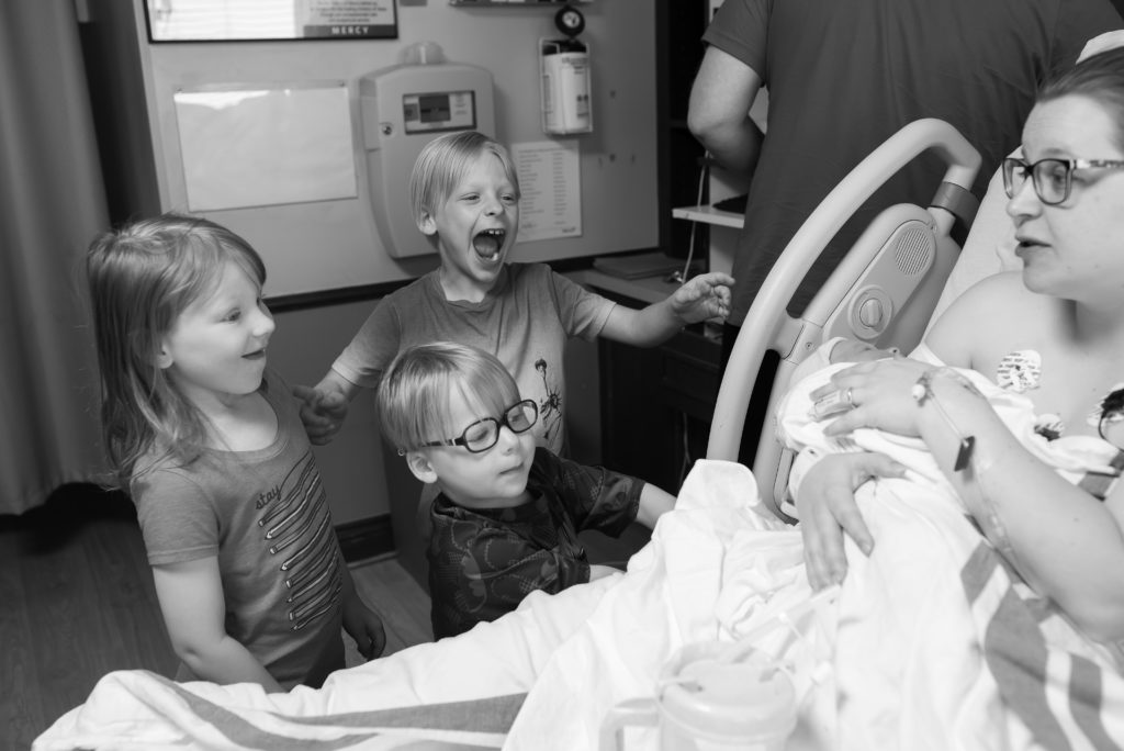 excited siblings meet the new baby in oklahoma city mercy hospital