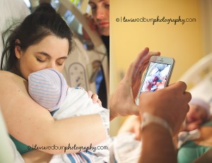 mom holding new baby, dad taking an iphone picture of new baby girl