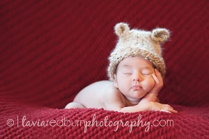 newborn baby girl sleeping with her head in one hand norman oklahoma