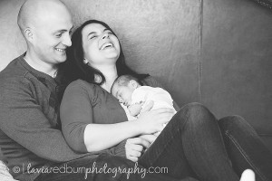 dad, mom laughing and newborn girl baby