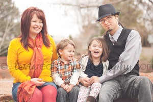 a cute family of four wearing vibrant colors in oklahoma city with a baby and toddler