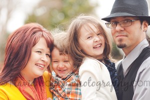 kids laughing and smiling with their parents during a lifestyle shoot in oklahoma