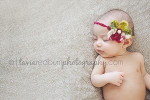 baby girl asleep with bow