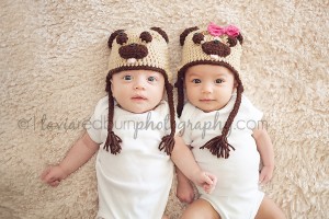 twins with knitted pug hats