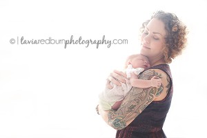 mom and newborn baby girl backlight bright and airy