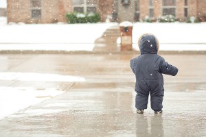 toddler playing in snow