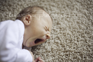 yawning newborn baby boy
