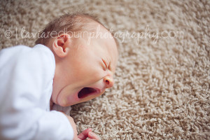 sweet yawning newborn baby boy