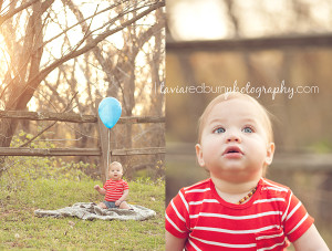 baby with blue balloon for first birthday