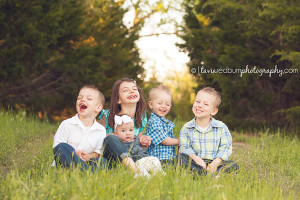 all five kids sitting and laughing