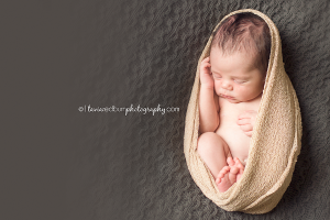 newborn pose, wrapped in neutral colors