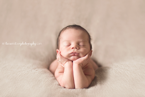 head in hands newborn pose