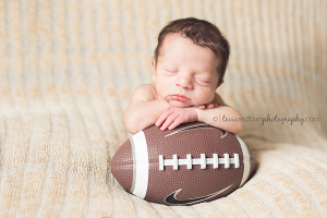newborn with football pose, boomer sooner, ou sooners oklahoma city photographer