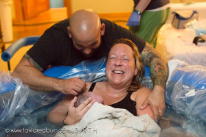 mom celebating the birth of her baby, oklahoma birth photography
