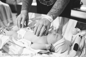 new dad with newborn baby girl in hospital, yukon oklahoma birth photography