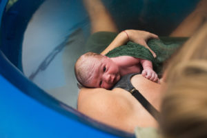 mom looking up after birth, homebirth oklahoma