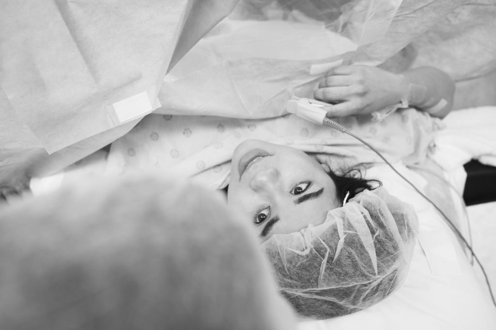 mom waiting to meet her baby during c-section