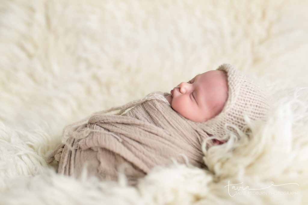 swaddled baby poses for newborns