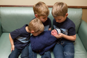 brothers and newborn