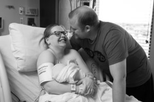 oklahoma birth photography mom and dad laughing and smiling after meeting their baby