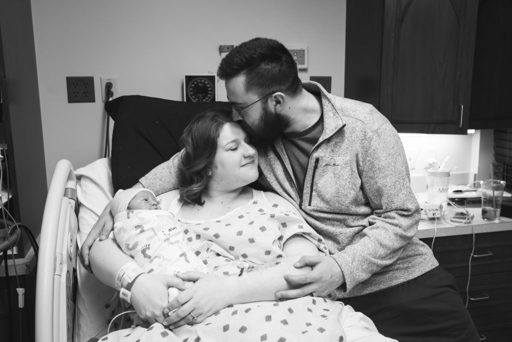Yukon Oklahoma Birth Photographer Mom and Dad holding baby for the first time in the hospital portrait